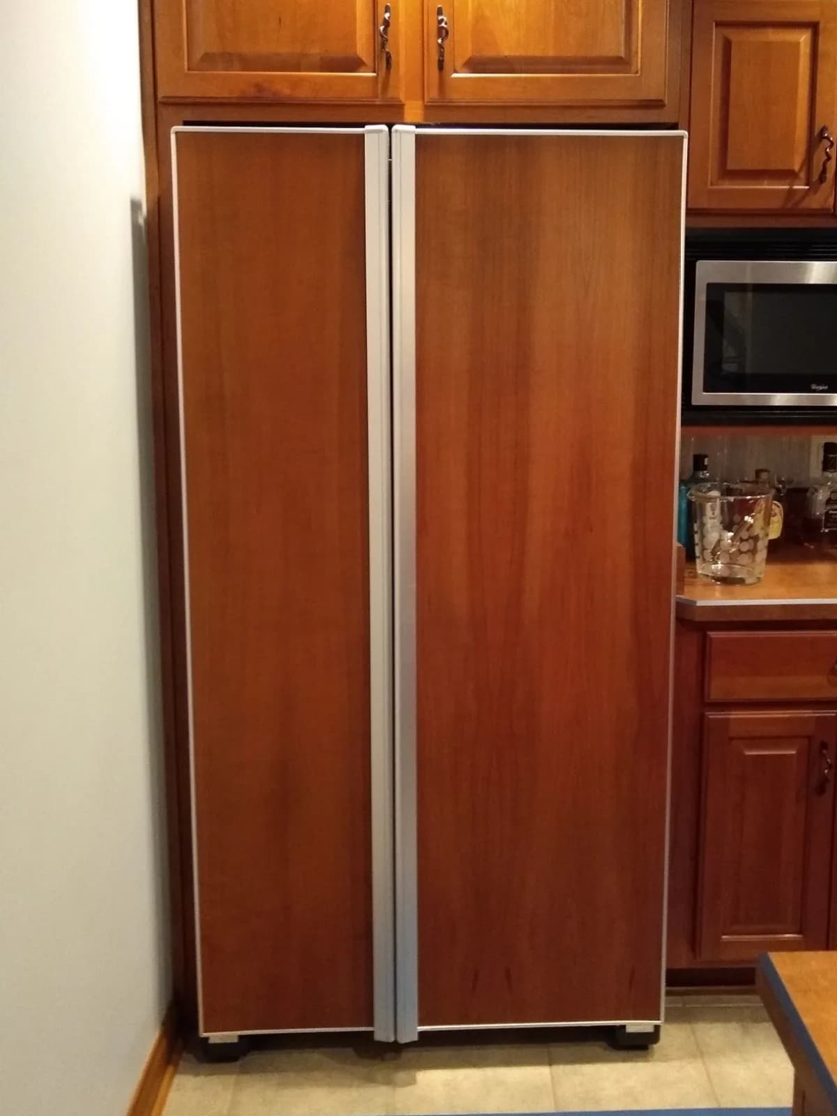 Before: Pantry wall and fridge panels painted navy